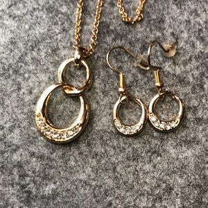 Beautiful fashion jewelry earrings and necklace set. Gold color with Cz stones